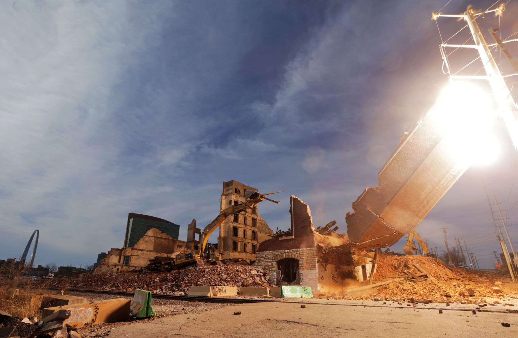 Demolition crew hits electric transmission line causing an explosion